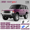 A purple 1:18 scale RC crawler truck with a black roof and off-road tires is shown in a studio setting.