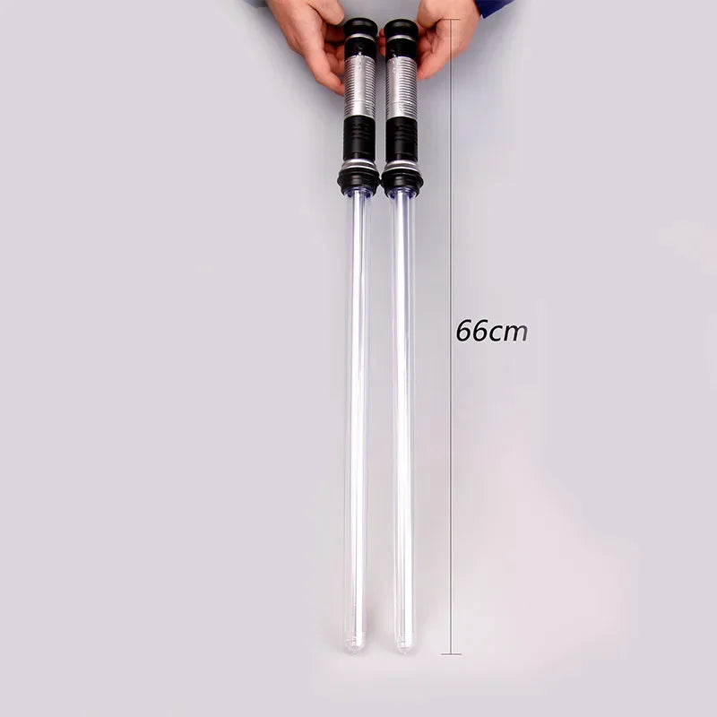 A pair of silver laser lightsaber toy swords is shown against a gray background with a measurement line indicating 66cm.