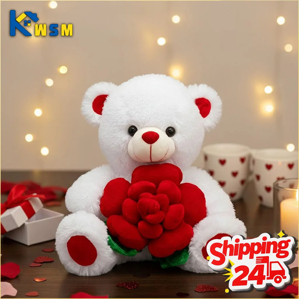 Adorable white plush bear holding a red rose against a blurred background of warm lights.
