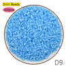 A pile of 5mm blue plastic beads, sold in a 500-piece kit for craft projects.