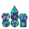 A set of seven glitter translucent polyhedral dice in various colors and shapes.