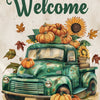 A vintage green pickup truck surrounded by autumn pumpkins and leaves.