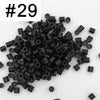 A pile of 1000 assorted black fuse beads for creative craft projects.