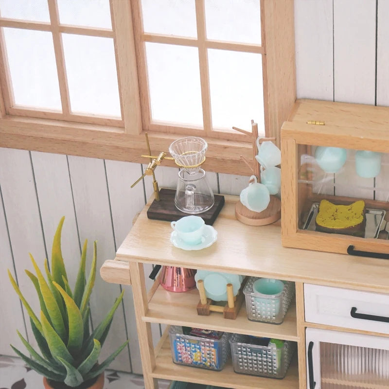 A wooden shelf displays a miniature hand-brewed coffee stand set for dollhouse with glass and ceramic items.