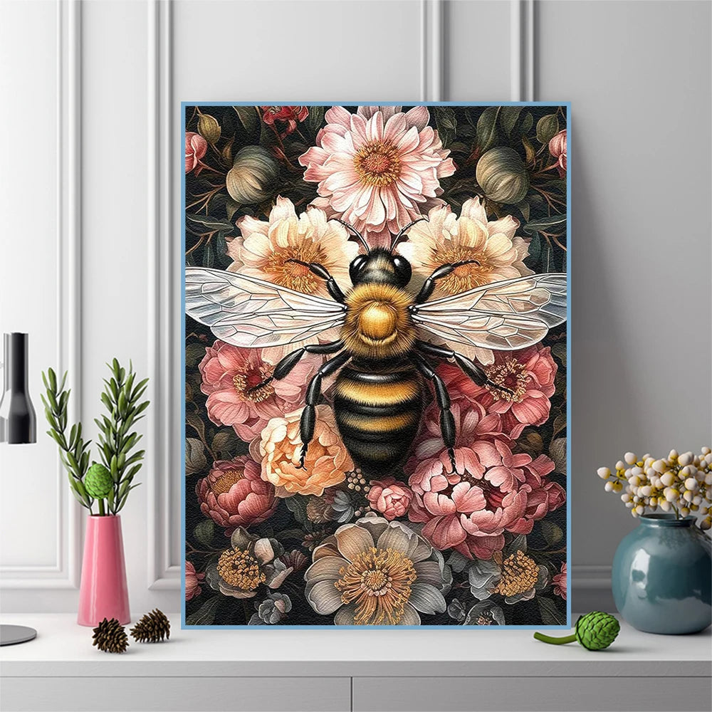 A close-up of a diamond painting featuring a bee surrounded by pink and orange flowers.