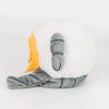 A soft white sheep plush doll with gray accents and an orange ear, resembling Don Quixote.