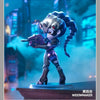 A collectible PVC figurine of Widowmaker in a purple and silver outfit, posed dramatically against a blue cityscape backgroun