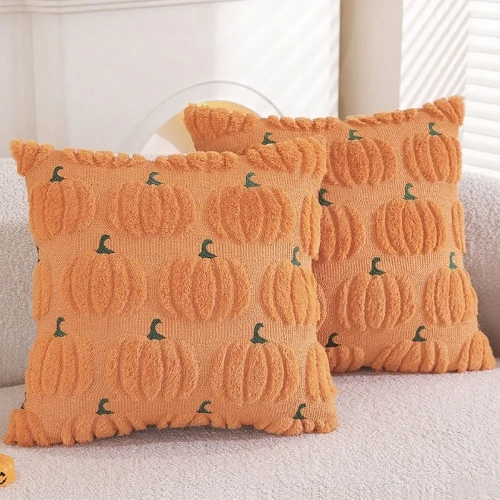 Set of orange pumpkin patterned Halloween pillow covers with green ghost accents