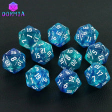 A set of ten glitter blue polyhedral dice, including d10s and d12s, displayed on a dark surface.