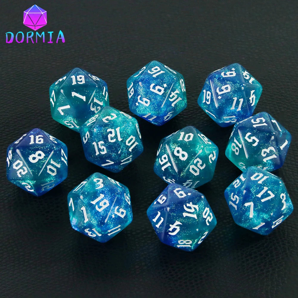 A set of ten glitter blue polyhedral dice, including d10s and d12s, displayed on a dark surface.