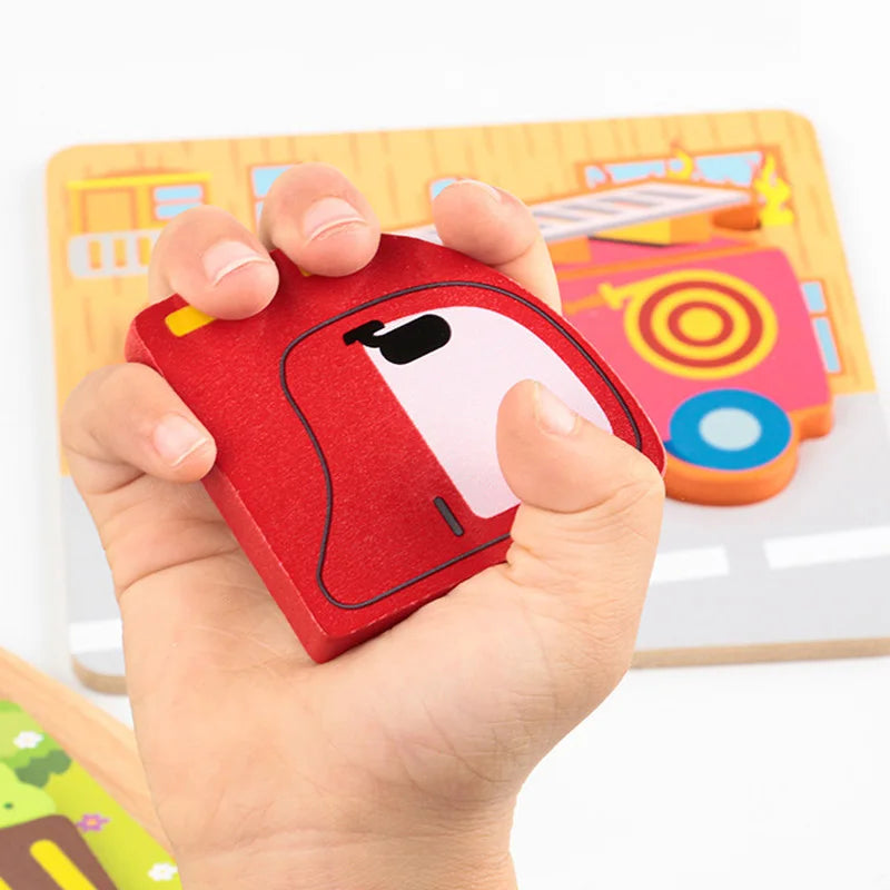 A hand holds a red wooden shape puzzle piece with a white cutout, placed on a colorful wooden learning mat.