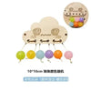 Montessori wooden busy board featuring a cloud design with colorful buttons for sensory play