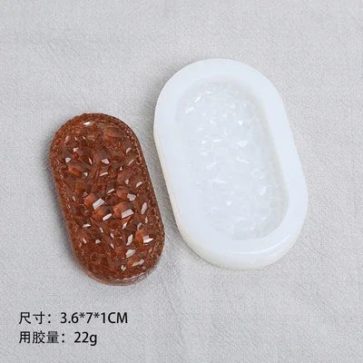 A set of flexible silicone resin molds in white and brown, including heart, round, oval, and rectangle shapes.