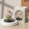 A box of 128 pieces of DIY micro building blocks forming an eternal flower garden with a dust cover.