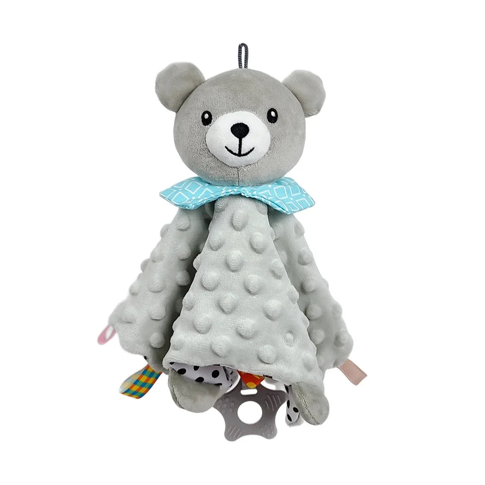 A gray plush baby bear security toy with a blue bow and a teething ring attached.