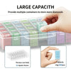 A hand is holding a clear plastic storage box filled with various colored beads for diamond painting, demonstrating its large