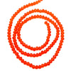 A string of bright orange faceted crystal beads coiled into a spiral shape.