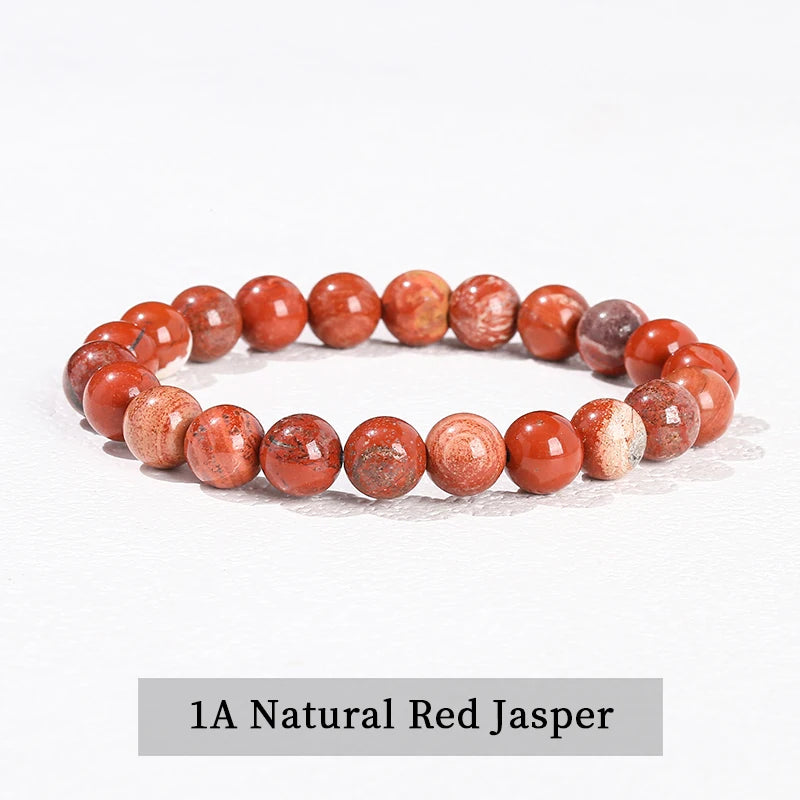 A bracelet made of 1A Natural Red Jasper beads, featuring various shades of reddish-orange and pink jasper stones.