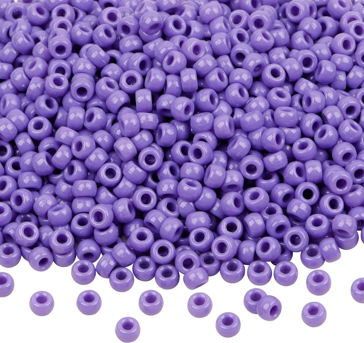 A pile of small purple pony beads for jewelry, braids, and crafts.