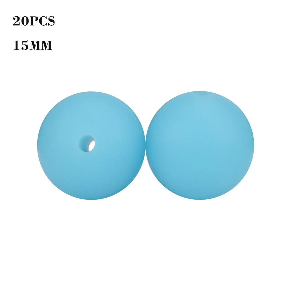 A pair of light blue silicone beads, 15mm in size, for jewelry making.