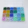 A plastic tray filled with various colors of flat round polymer clay beads for DIY jewelry making