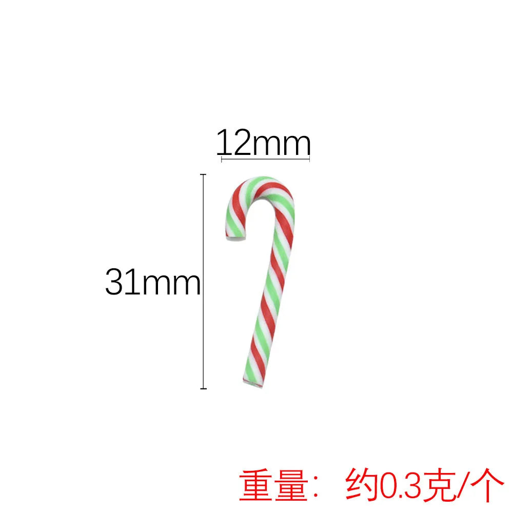 A white and green striped candy cane shaped polymer clay charm, 12mm long.