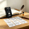 A deck of Spirit Messages Oracle Cards with crescent moon symbols laid out on a wooden table.