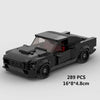 A black classic rally car building block set with a transparent window and detailed features.