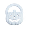 White silicone pumpkin baby teether with a textured handle and carved face for soothing relief.