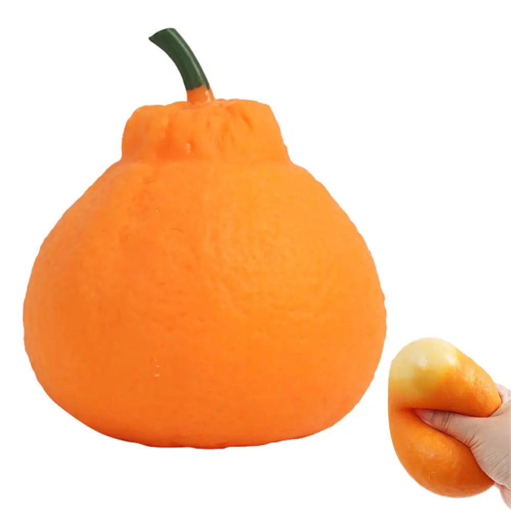 An orange stress ball with a green stem, designed for anxiety relief.