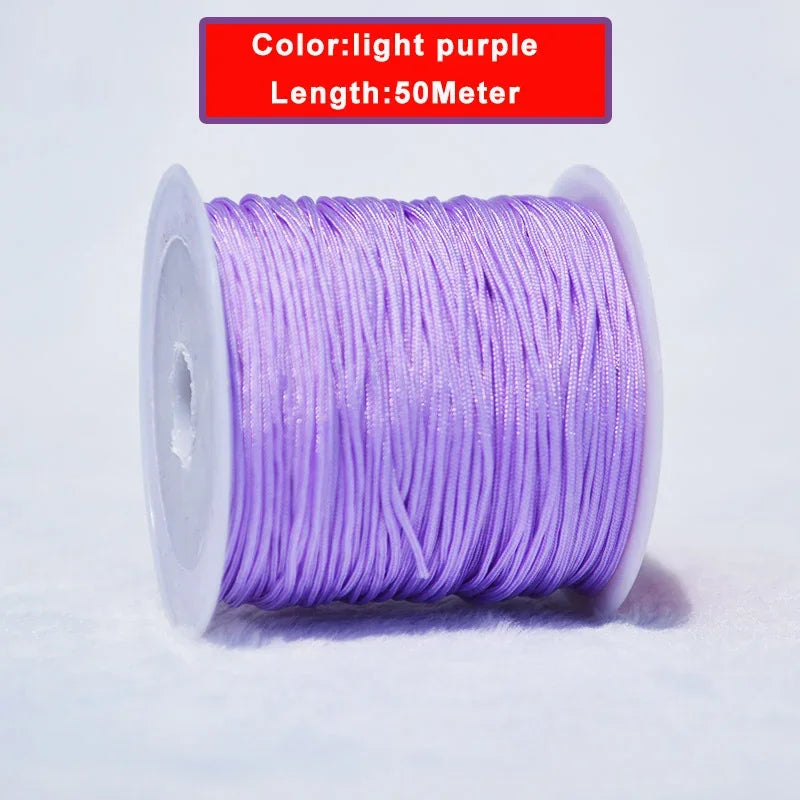 A spool of light purple nylon knotting cord for jewelry making, 50 meters long.
