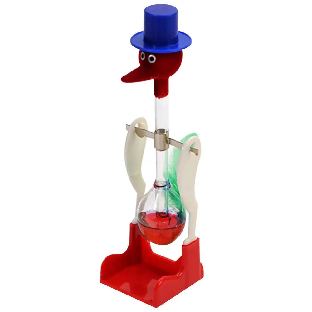A red and blue classic drinking bird toy with a long neck and a glass bulb on a red stand.