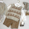A beige knit sweater and matching tan pants set for a toddler, displayed on a white surface.