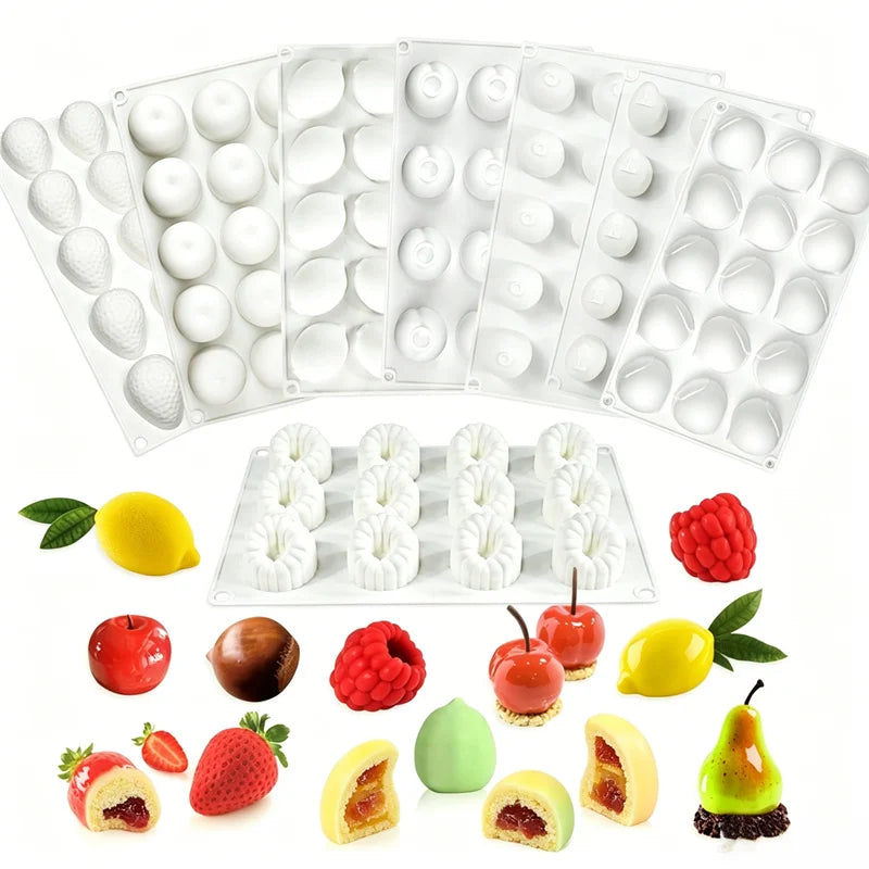 A set of white silicone molds for making various 3D fruit shapes for baking and desserts.