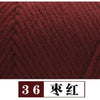 A close-up view of deep maroon yarn labeled as color 36, dark red.