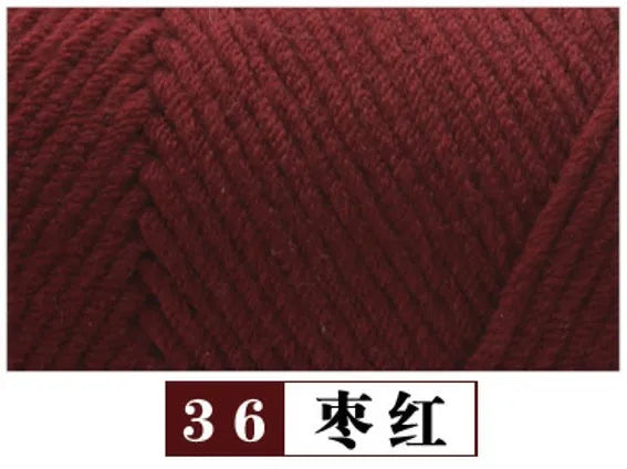 A close-up view of deep maroon yarn labeled as color 36, dark red.