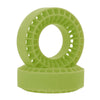 A light green silicone rubber tire insert with a honeycomb pattern, shown resting on its base.