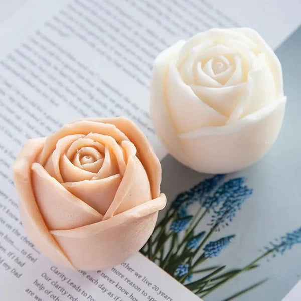A pale peach silicone rose mold is shown on a sheet of paper, illustrating a detailed rose flower.