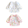 A pack of two white baby bibs with a light pattern for feeding