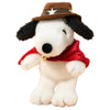A white plush dog wearing a brown cowboy hat and a red bandana.