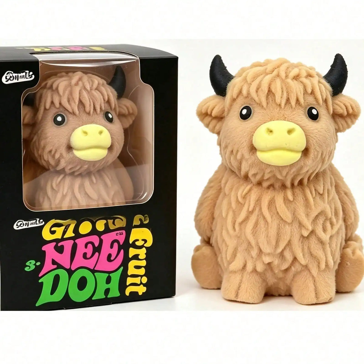 A fluffy brown Scottish Highland cow squishy toy in its packaging box.