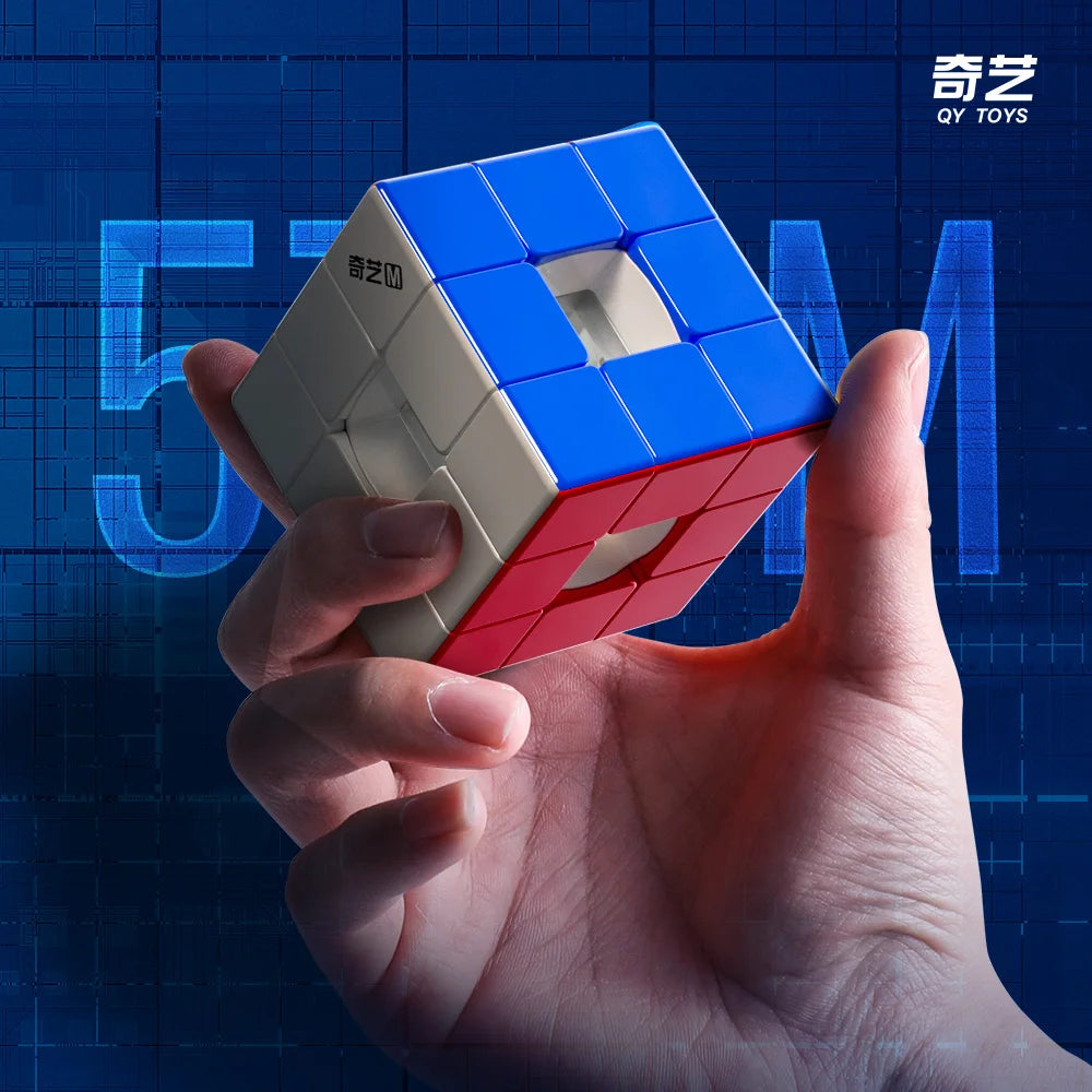 A hand holds a blue and beige hollow magnetic 3x3 speed cube puzzle against a dark blue, digital background.
