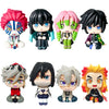 A set of four Demon Slayer anime action figures featuring characters like Tanjirou, Nezuko, Giyuu, and Mitsuri.