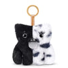 A black and white grumpy alien plush keychain with a gold keyring.