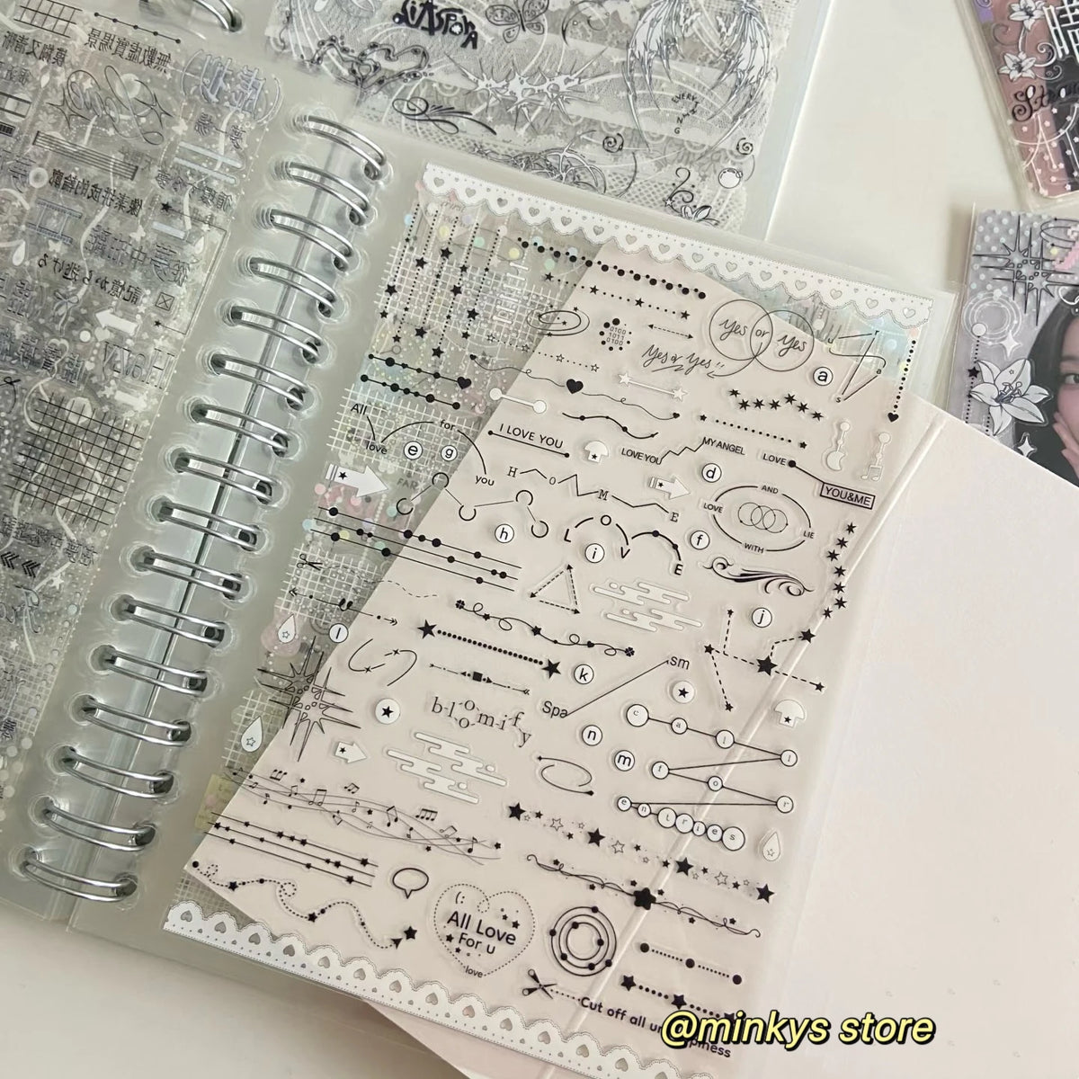 A clear plastic sheet of decorative stickers and doodles for journaling and scrapbooking inside a spiral-bound book.