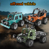 Three metal building block off-road vehicles and excavators in green, orange, and teal colors.
