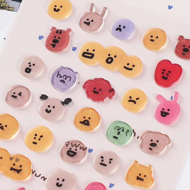 A collection of colorful 3D smile face crystal stickers for crafting and decorating