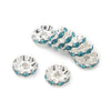 A collection of silver spacer beads featuring blue crystal rhinestones for jewelry making.