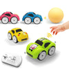 A set of colorful RC cars, including pink and blue models, a yellow car, and a lime green car, along with a white remote cont