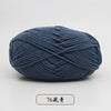 A ball of dark blue pre-dyed milk cotton yarn, labeled as 76-count thread, shown from the side.